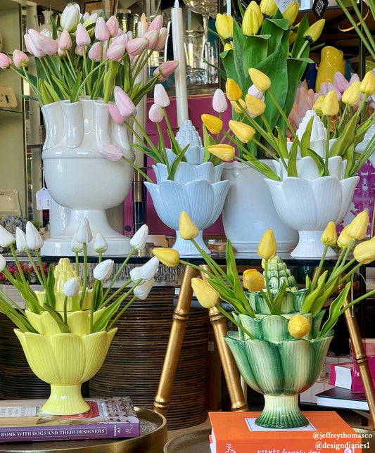 LOOMLAN Artichoke Handmade Ceramic Tulipiere in white, displayed with pink and yellow tulips in a shop setting