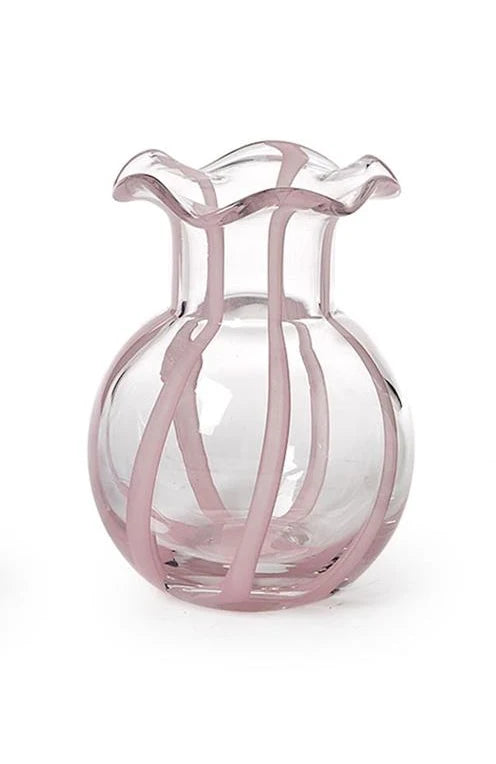 The Two's Company Ruffled Ribbon Vase by Two's Company features a clear, round body with a fluted ruffled rim and curving vertical pink stripes along its surface, making it perfect for decorative arrangements and displayed against a white background.