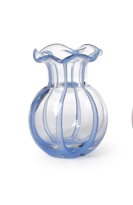 The Two’s Company Ruffled Ribbon Vase by Two’s Company features a clear glass design with a round body, vertical blue stripes, and a flared wavy rim. Perfect for decorative arrangements, this vase is showcased against a white background.