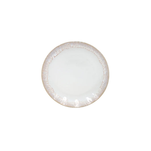 The Costa Nova “Taormina - White” Salad Plate by Costa Nova is a round, white ceramic plate featuring a textured, slightly brownish rim, shown from above against a plain white background.