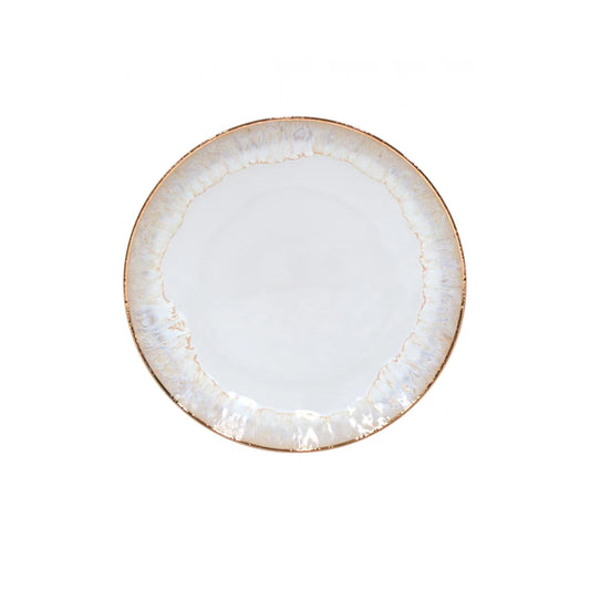 The Costa Nova “Taormina - Gold” Dinner Plate by Costa Nova is a round, white ceramic plate featuring a lightly textured, slightly uneven rim with an elegant light brown and off-white marbled design. Its center is smooth and plain. The clean plate is shown from above against a white background.