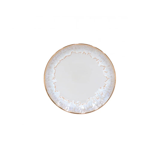 Costa Nova “Taormina - Gold” Salad Plate by Costa Nova, a round ceramic plate featuring a white center and an irregular, textured edge finished with a metallic gold rim. The plate is photographed against a plain white background.