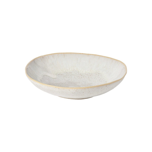 The Casafina “Evissa - Sand Beige” Pasta Bowl by Casafina is a shallow, round ceramic bowl featuring a slightly uneven rim and a speckled white glaze, shown against a plain white background.