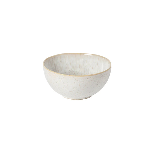 The Casafina “Evissa - Sand Beige” cereal bowl by Casafina features a small, round shape with a slightly textured surface and a subtle speckled pattern, displayed against a plain white background.