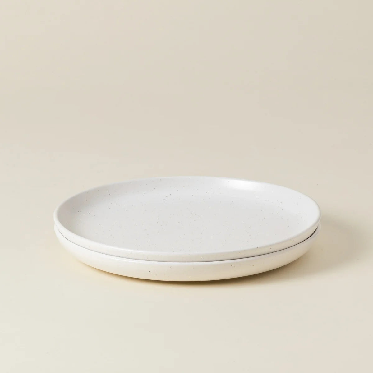 Two Casafina “Pacifica - Vanilla Beige” salad plates are stacked together on a light beige background.