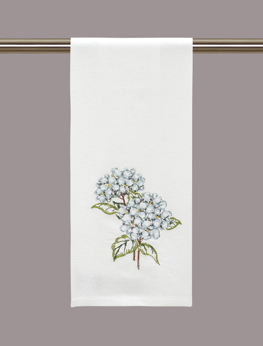Peking Handicraft Hydrangea Kitchen Towel hung on rod, white linen with embroidered blue hydrangea cluster and green leaves