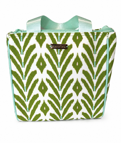 Laura Park Petite Frond Green Lunch Bag: This stylish lunch bag from Laura Park Designs features a green and white zigzag leaf pattern, light blue zipper, handles, and trim, along with a metallic brand label on the front.