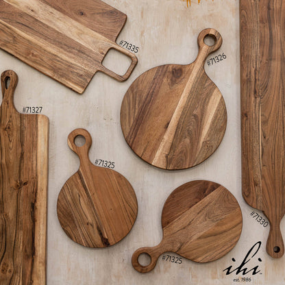 Assorted India Handicrafts Inc wooden serving and cutting boards including round and rectangular shapes