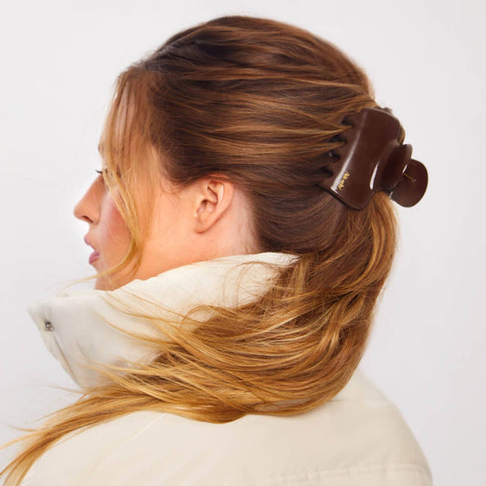 Chocolate brown KITSCH Puffy Cloud Clip securing long auburn hair in a half-up style, side profile view
