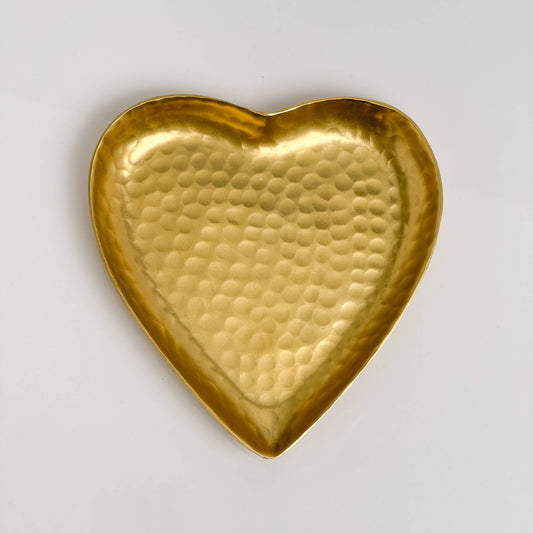 Gold hammered aluminum heart-shaped decorative tray, flat lay