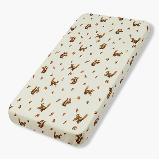Milkbarn crib sheet with brown squirrel and acorn print on cream background