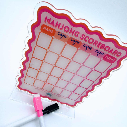 My Fair Mahjong scalloped scoreboard angled view showing grid layout with pink and black dry erase markers