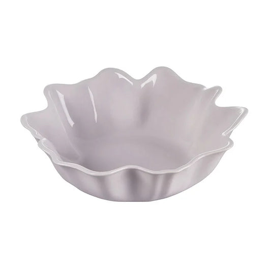 Le Creuset Iris Collection lavender serving bowl with scalloped petal-shaped edges