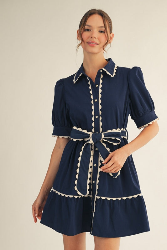 Jodifl Navy Scallop Trim Button Down Babydoll Dress worn front view with cream scalloped trim and tie belt
