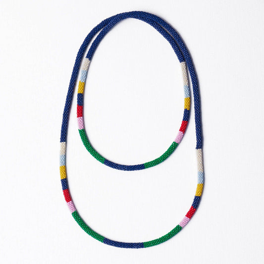 INK + ALLOY Allie Seed Bead Long Necklace in navy with multicolor striped sections, laid out flat