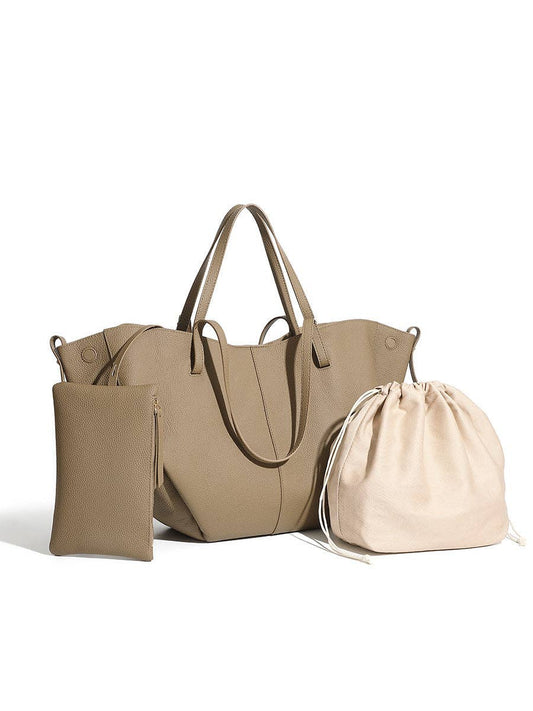 Parker & Hyde - Brooklyn Tote - Oyster: This chic oyster-colored tote bag by Parker & Hyde includes double handles, a coordinating zippered pouch, and a cream drawstring bag, all showcased against a white background.