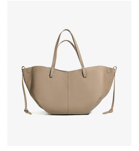 A Parker & Hyde Brooklyn Tote in Oyster leather, featuring two short handles and a long shoulder strap on each side, with a structured, slightly rounded shape, set against a plain white background.