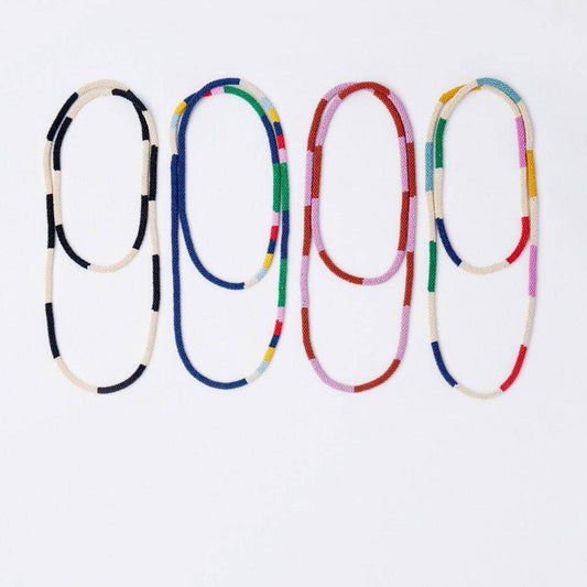 INK + ALLOY Allie Seed Bead Long Necklace in four colorway variations arranged in rows showing navy, red, and pink options