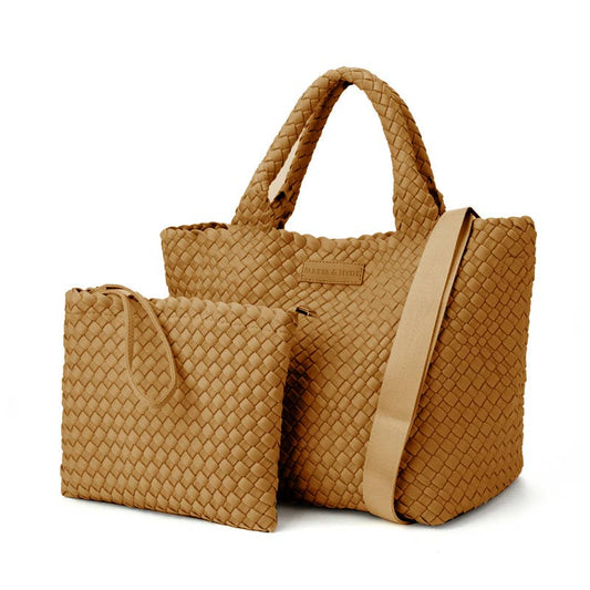 The image features the Parker & Hyde Classic Woven Tote in Camel—a spacious tote bag with handles and a shoulder strap—paired with a matching smaller zippered pouch, both displaying a signature basketweave texture.
