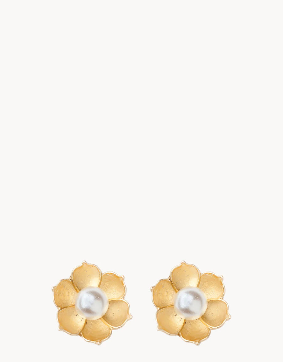 A pair of Spartina Sea La Vie Bloom Stud Earrings by Spartina, crafted in a gold-tone flower shape with six petals and a luminous round white pearl at the center of each earring. Inspired by the delicate beauty of magnolia charms, these inspirational earrings make an elegant addition to any jewelry collection. Displayed against a plain white background.