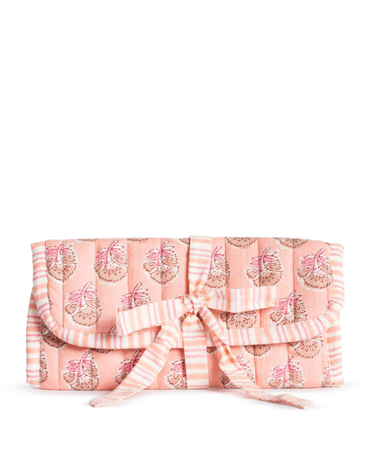 The Royal Standard Layla Quilted Jewelry Roll in pink with pear print and striped bow, closed flat view
