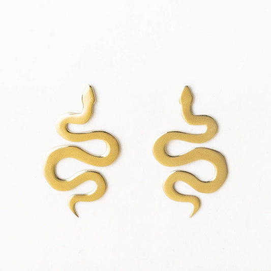 INK + ALLOY Kara Snake Post Earrings in brass, pair of wavy serpent-shaped studs on white background