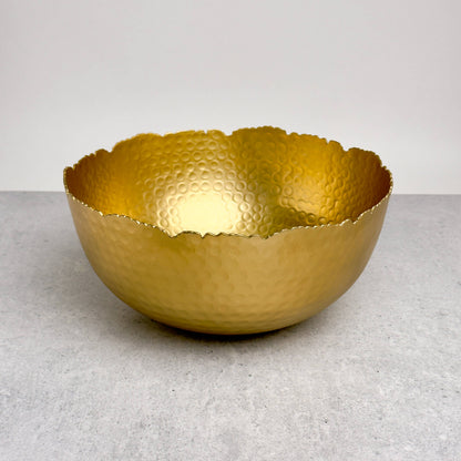India Handicrafts Inc Large Gilded Hammered Bowl three-quarter view with wavy rim and textured gold surface