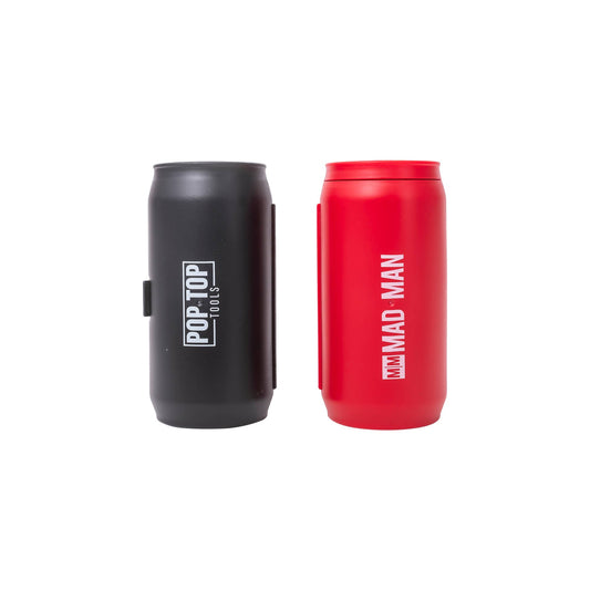 Two can-shaped containers from Mad Man stand side by side against a plain white background—one sleek black and the other vibrant red, both labeled “Mad Man - Pop Top Tools.” Each container cleverly disguises a compact toolkit inside, making them perfect for storing your precision screwdriver set.