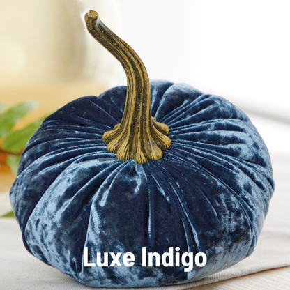 A plush, indigo velvet pumpkin from Your Heart’s Content, featuring a realistic stem, rests on a white surface—making it the perfect Thanksgiving centerpiece. “Your Heart’s Content - Pumpkin Large Velvet, Fall Mantel Decor, Halloween Table” is displayed at the bottom of the image.