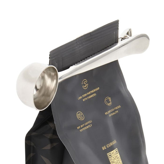 HIC Fino coffee scoop with stainless steel bowl and white handle attached to black fabric bag clip