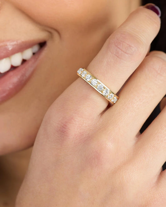 Melinda Maria Ashley Infinity Ring in gold with pave diamond band, worn on finger