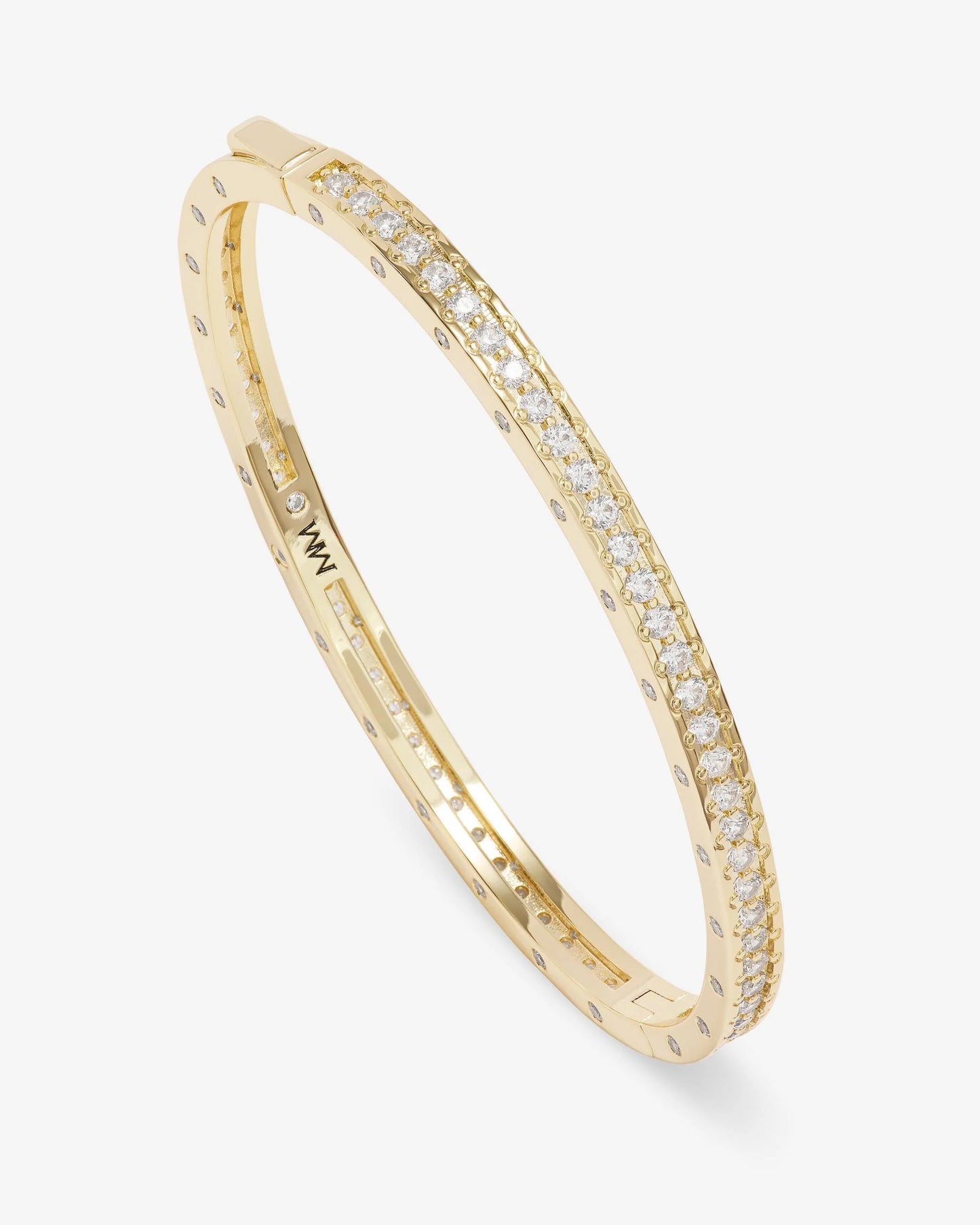 The Melinda Maria Ashley Pave Cuff Gold by Melinda Maria is an oval gold cuff bracelet featuring a row of sparkling pavé simulated diamonds along its top edge, displayed at an angle on a plain white background.