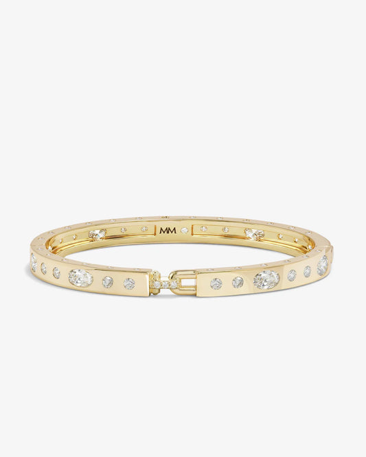 Melinda Maria Ashley Sunset Lock Cuff in gold with cubic zirconia accents and toggle closure