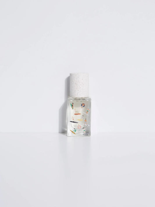 Maison Matine 0.5 fl oz fragrance bottle showing diverse illustrated figures on clear glass