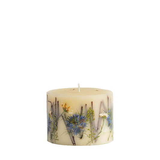 Rosy Rings Petite Botanical Candle with cream wax and pressed blue wildflowers and herbs throughout