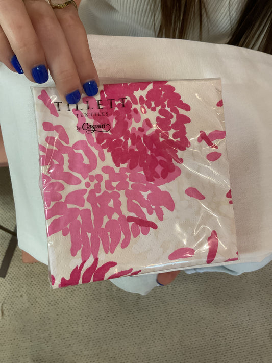 Caspari Chrysanthemum Raspberry cocktail napkin with pink chrysanthemum design, held in hand