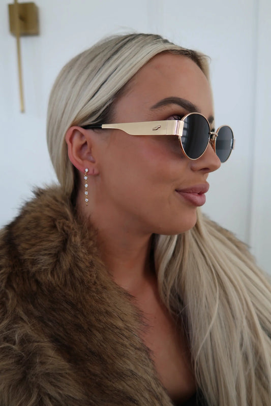 CHANSUTTPEARLS Lola Earrings worn as delicate pearl strand drops on model