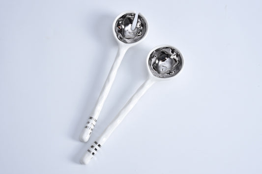Pampa Bay porcelain salad server set in platinum with white handles and metallic patterned bowls
