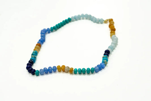 Coastal Grit Clearwater Beaded Necklace with multi-colored gemstone beads in blue, teal, amber, and white tones