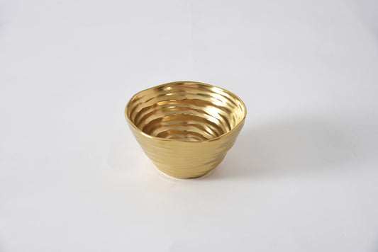 Pampa Bay Dorato snack bowl in gold metal with ribbed texture detail