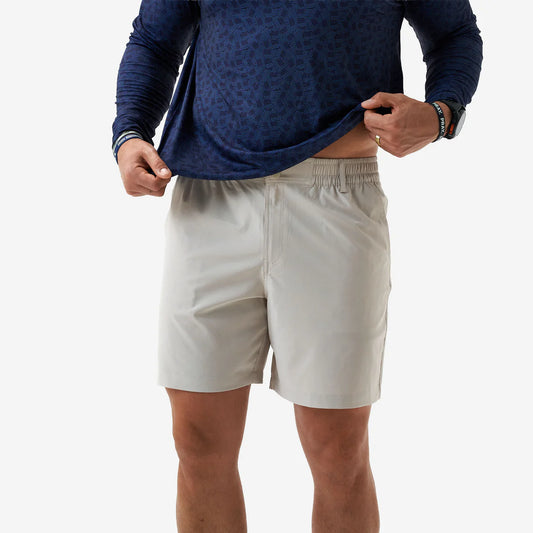 Burlebo Everyday Short 5.5" in cream worn with navy top, side view