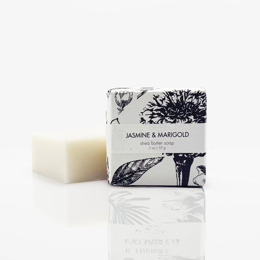 Formulary 55 petite Jasmine & Marigold shea butter soap in pale yellow next to small illustrated white box