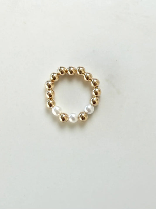 Coastal Grit Cove Ring Size 7 with gold and white pearl beads arranged in a circular pattern