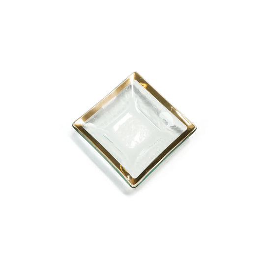Annieglass Roman Antique small square dish with clear glass center and gold trim, angled view