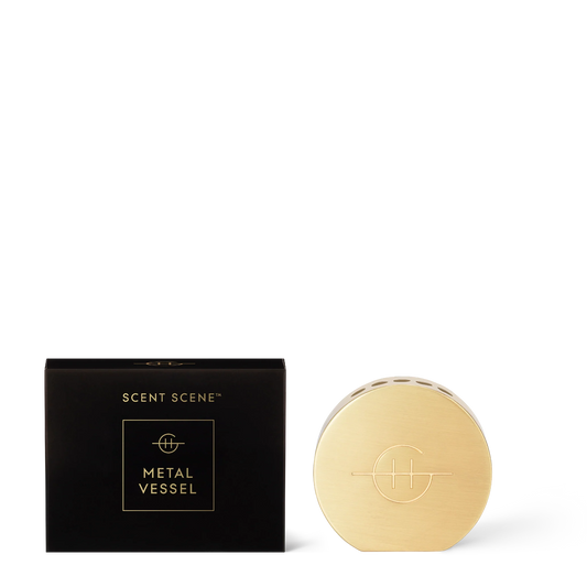 Glasshouse Scent Scene metal vessel in pale gold with black packaging box