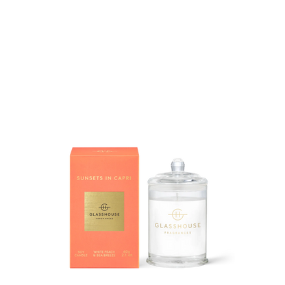 Glasshouse Sunsets in Capri 2.1oz candle in clear glass jar with coral orange box packaging