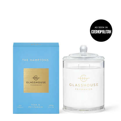 Glasshouse The Hamptons 13.4oz candle with clear glass jar and lid next to blue box packaging