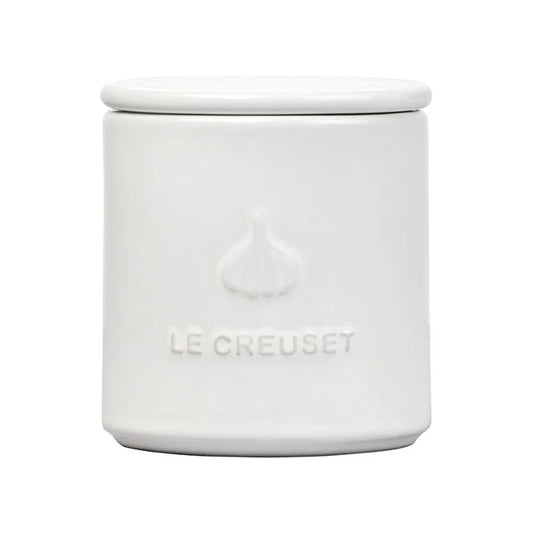 Le Creuset Garlic Keeper in white stoneware with embossed garlic design and lid