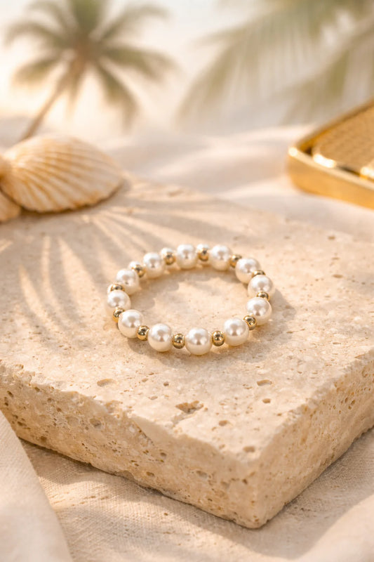 Coastal Grit Elena Ring Size 6 with white pearl and gold bead design on stone surface