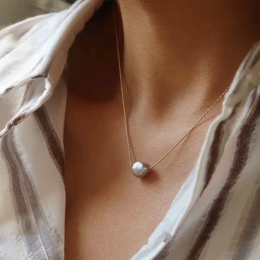 Coastal Grit Sole Luxe Necklace Purple worn as single pearl pendant on fine gold chain
